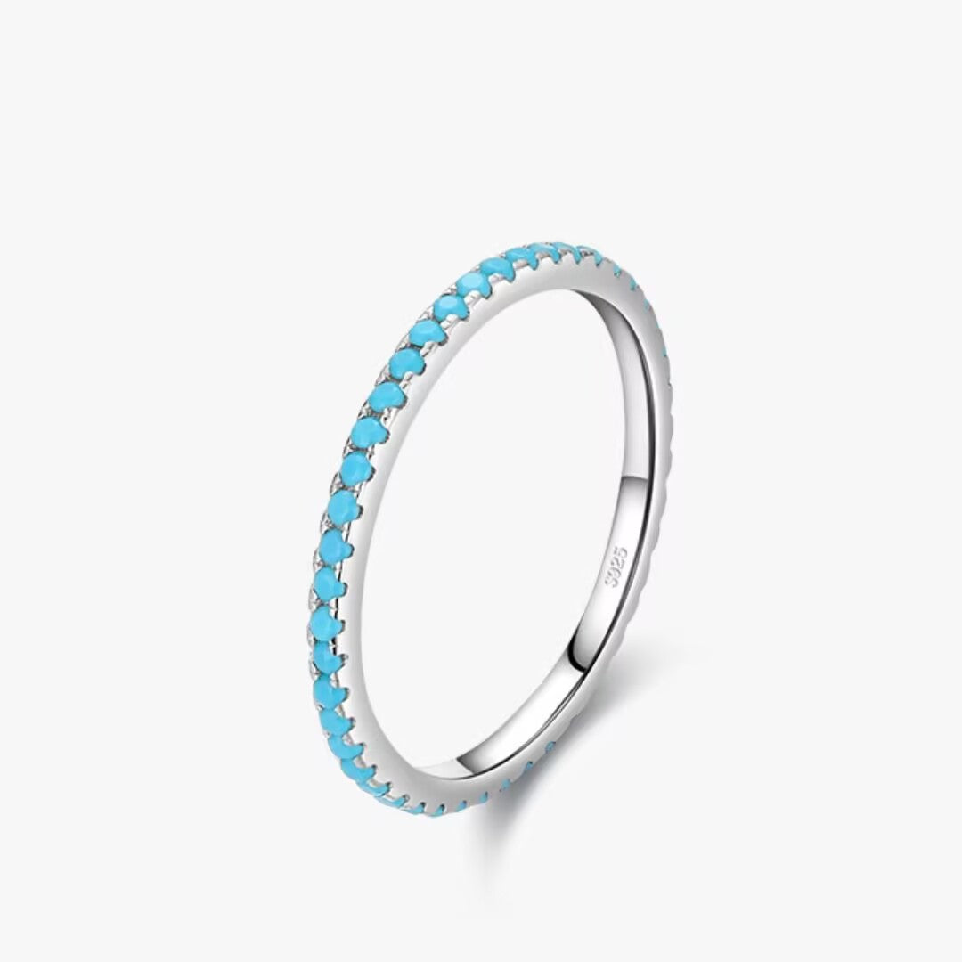 Bague fine en argent 925 sertie de petites pierres turquoise bleues, nom "Simplicité Céleste".