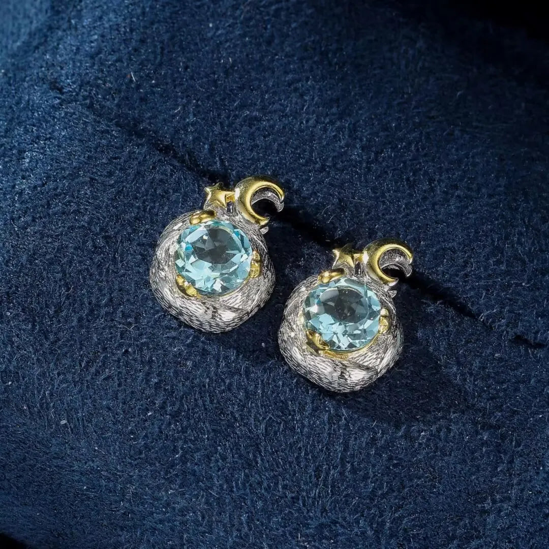 Paire de boucles d'oreilles en argent 925 ornées de topazes bleues rondes, style "Charme Céleste".