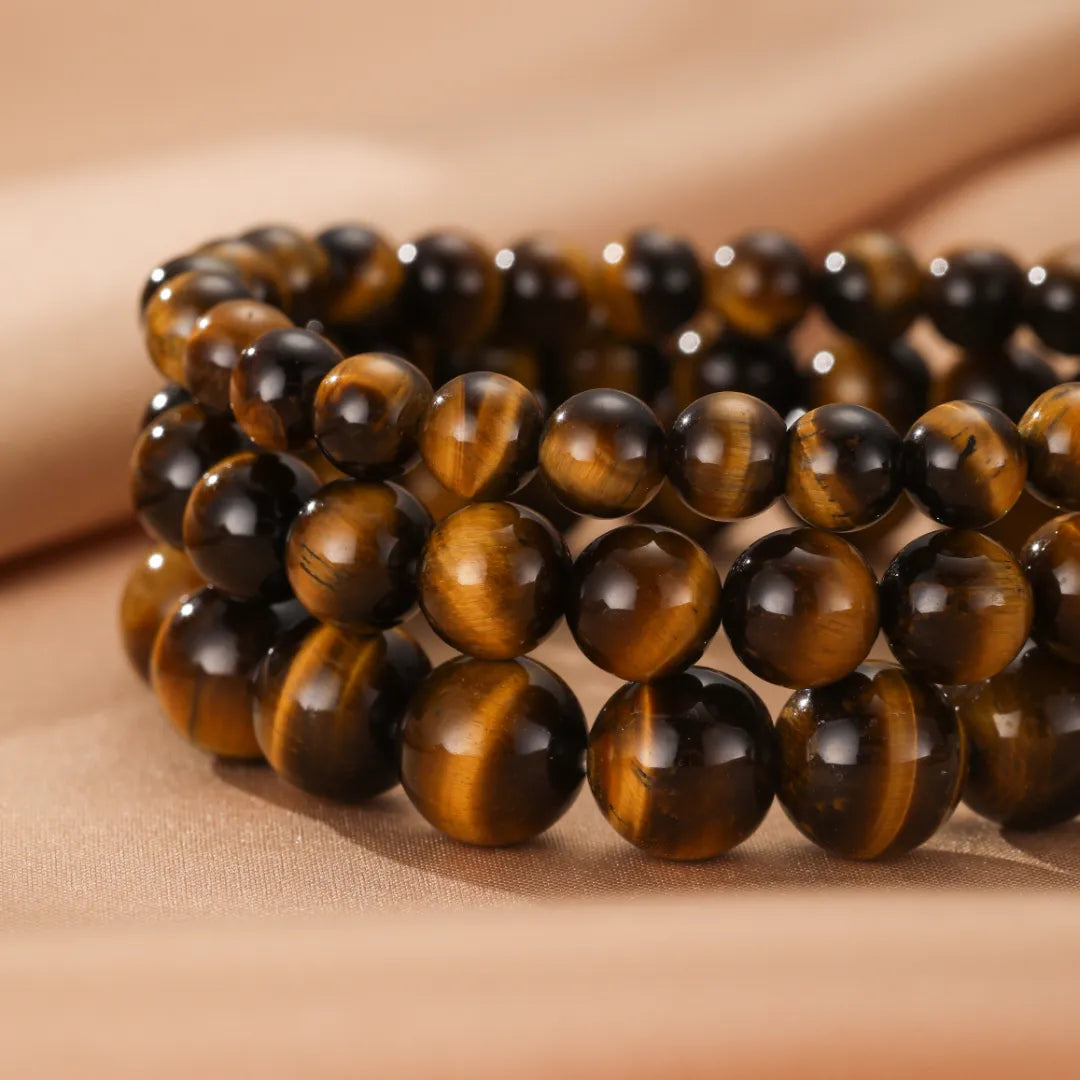 Bracelet "Force Pure" fait de perles d'œil de tigre naturelles aux couleurs chaudes et aux reflets chatoyants.