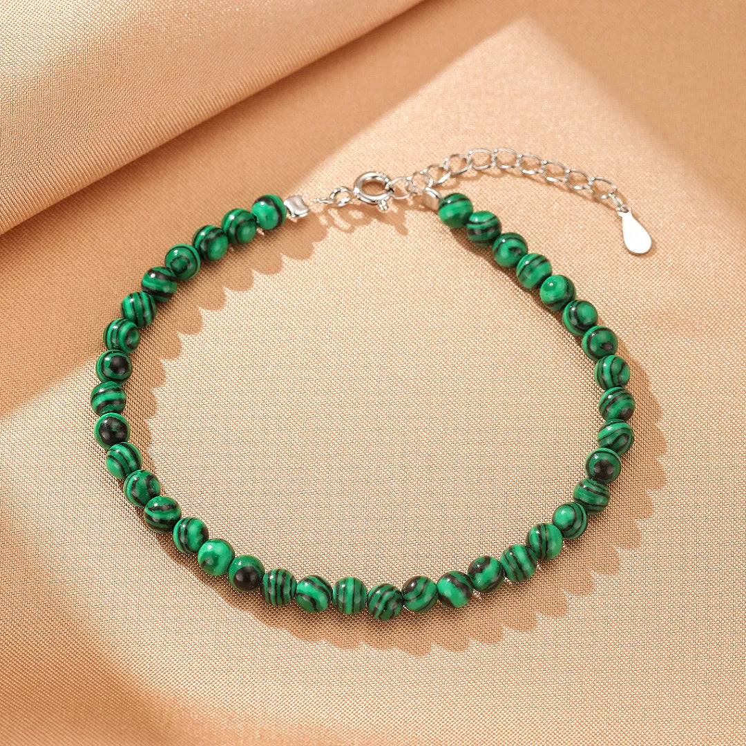 Bracelet "Veines d'Harmonie" en malachite naturelle et argent avec fermoir ajustable.