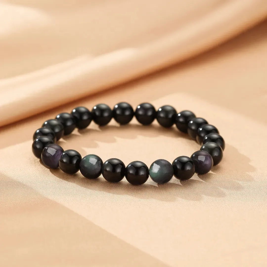 Bracelet fait de perles d'obsidienne arc-en-ciel et d'obsidienne noire, un bracelet de perles élégant et mystérieux.