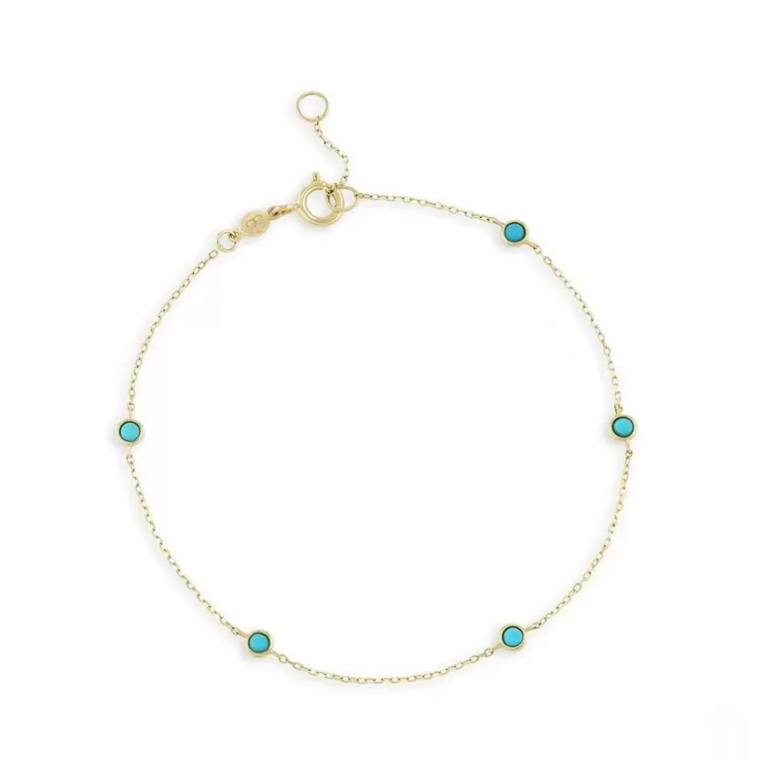 Bracelet "Énergie Solaire" en argent doré or, orné de petites pierres turquoises rondes espacées sur une fine chaîne.