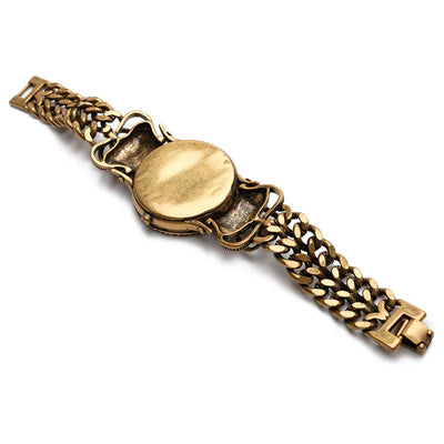 Bracelet vintage style en laiton avec un fermoir à maillons épais et un cabochon rond central