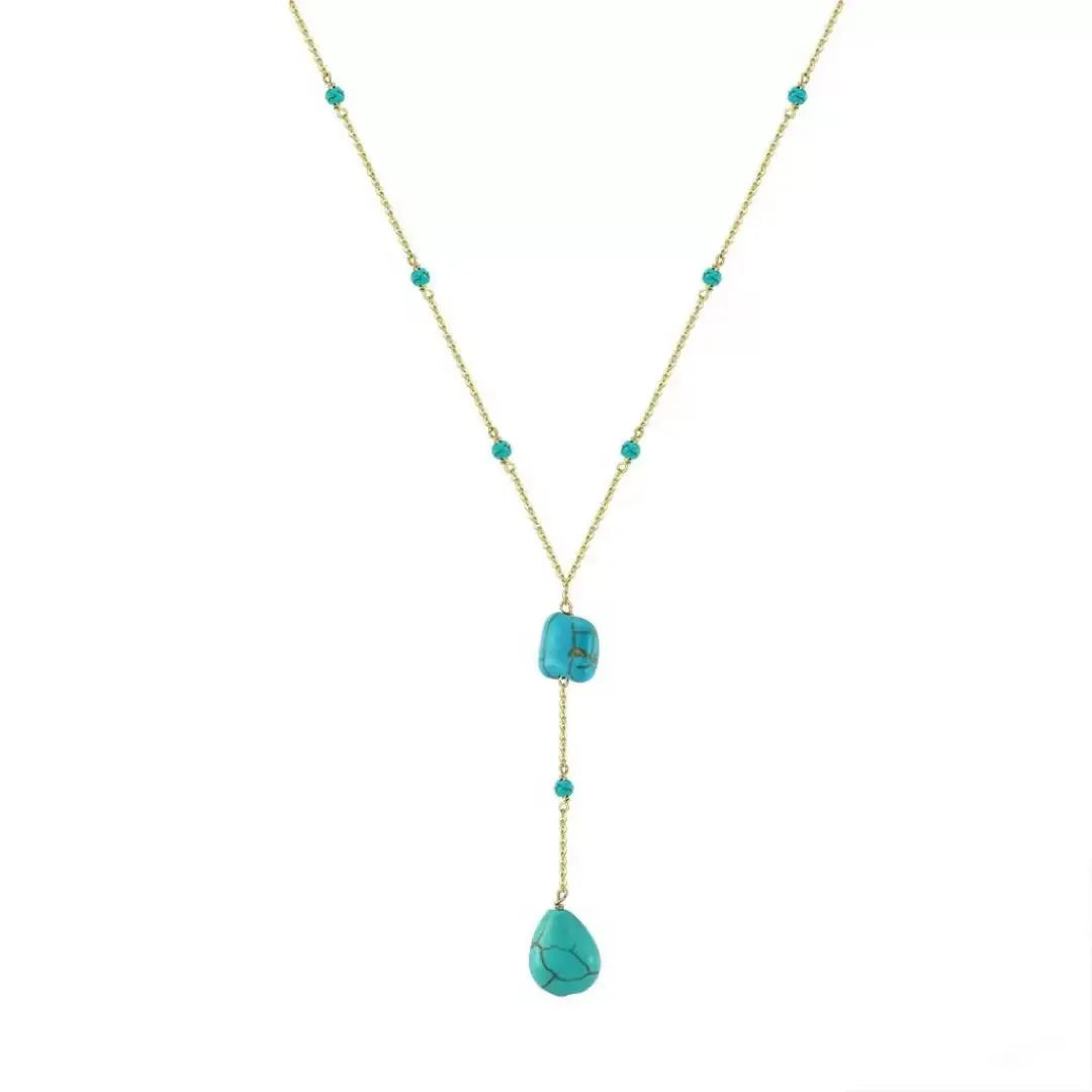 Collier Y en argent avec des pierres de turquoise naturelles et une chaîne dorée.