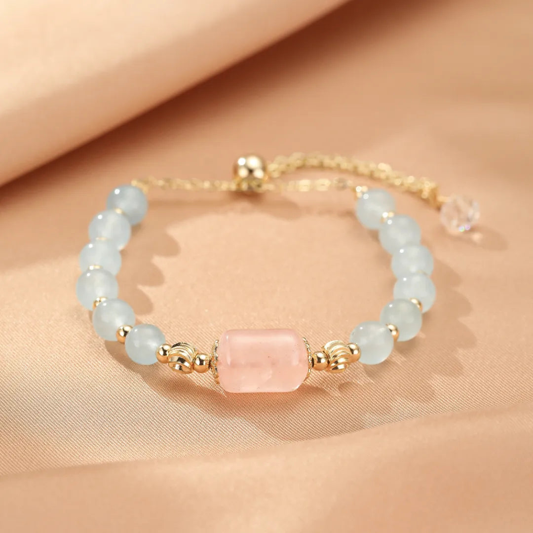 Bracelet "Souffle Doux" en aigue-marine et quartz rose avec fermoir doré et perle de cristal
