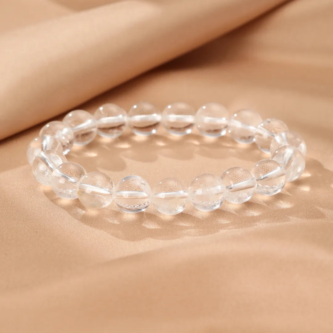 Bracelet en cristal de roche naturel, perles rondes et transparentes pour la clarté et la pureté.