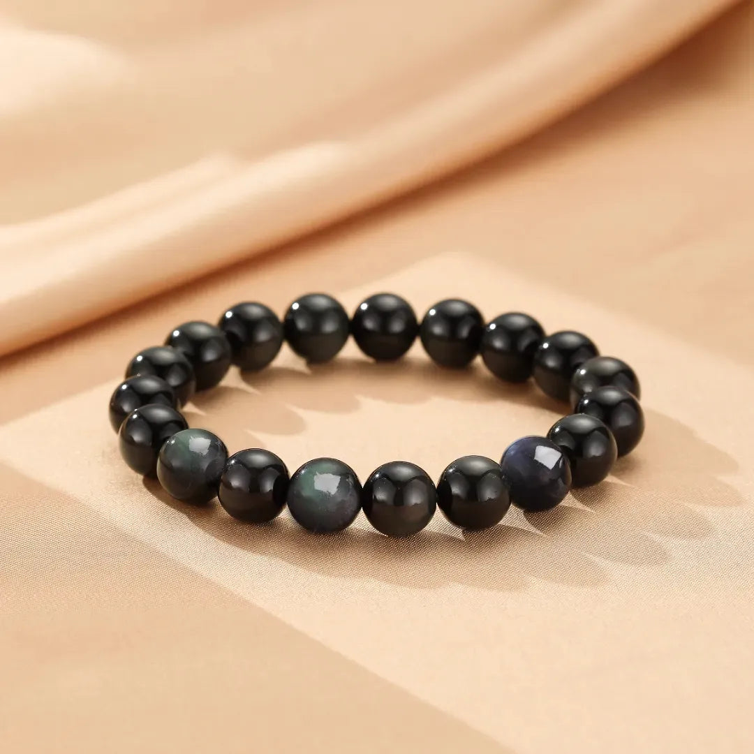 Bracelet "Profondeur Mystérieuse" en obsidienne arc-en-ciel, perles noires et irisées.
