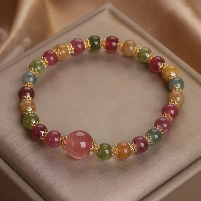 Bracelet "Lumière Colorée" en tourmaline et quartz fraise avec perles multicolores et fermoir doré.