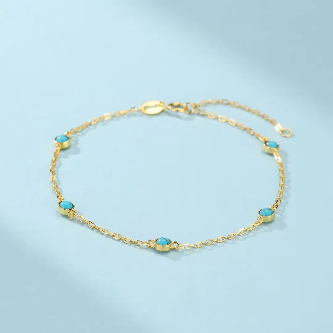 Bracelet fin en argent doré, orné de turquoise bleues, nom "Énergie Solaire"