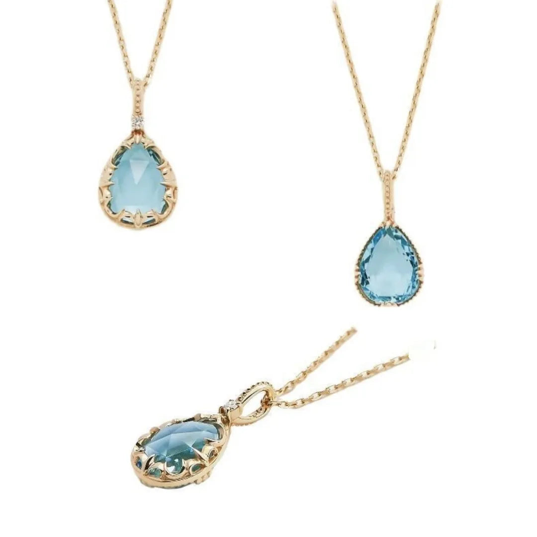 Collier Topaze "Éclat Marin" en Argent 925 Doré à l'Or 14K avec une pierre bleu clair en forme de goutte et une délicate chaîne.